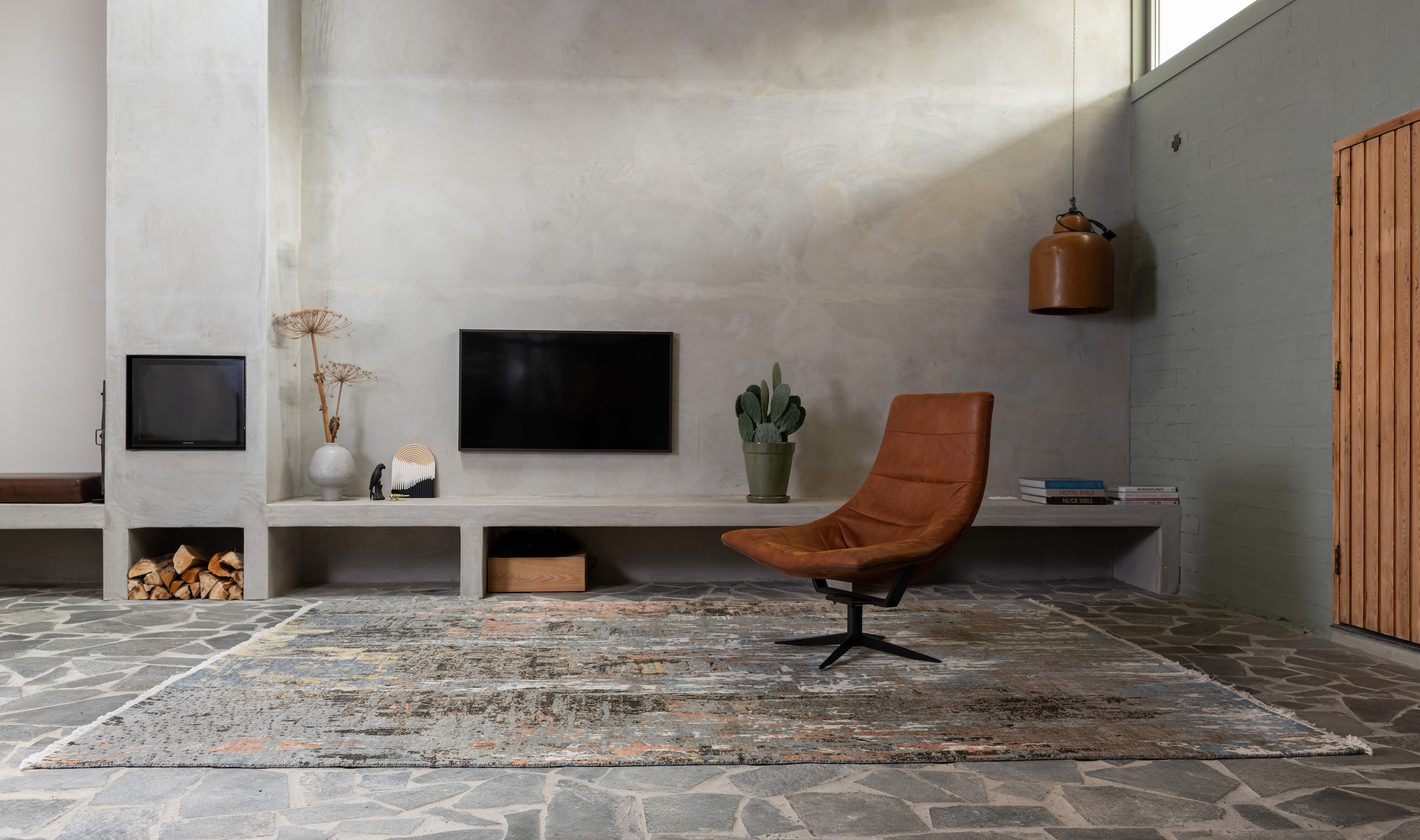 Welk vloerkleed bij een cognac bank?